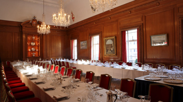 Livery Hall set in banqueting style rows for a christmas dinner with natural daylight and chandeliers Brewers' Hall Christmas Party EC2
