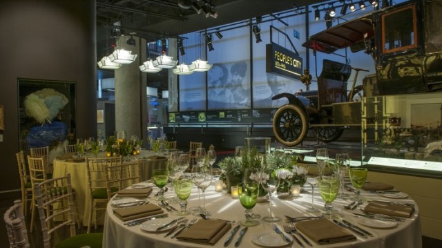 Terrace Gallery set for a private dinner with round tables and colour co-ordinated tbale decor with view of the Museum of London Summer Party EC2Y