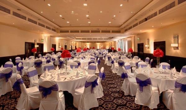 Tower Suite set for a Christmas dinner with round tables and white linen Tower Hotel Christmas Party E1