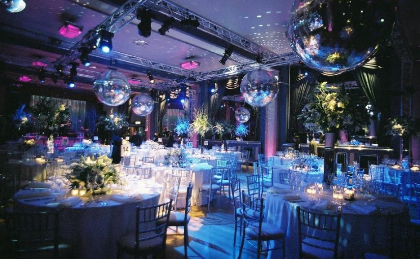 Bloomsbury Ballroom Venue Hire London WC1, stunning flower centre pieces, uplighters, disco balls