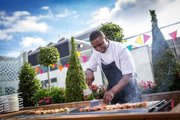30 Euston Square Summer Party NW1 outside on terrace, chef cooking a barbecue