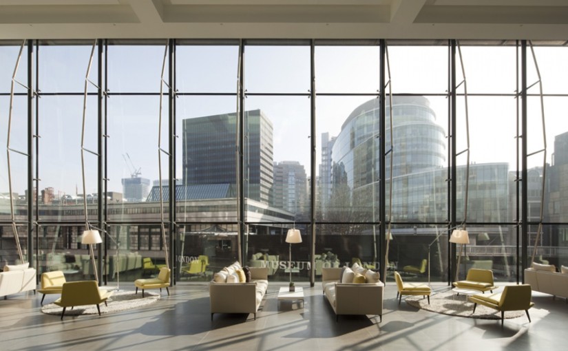 Main Reception with sweeping views of london's iconic buildings from the high floor to ceiling windows and informal sofa seating below 200 Aldersgate Venue Hire EC1