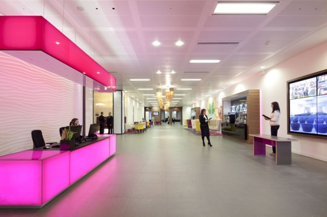 Reception area with help desk with pink lights and large open plan space 200 Aldersgate Venue Hire EC1