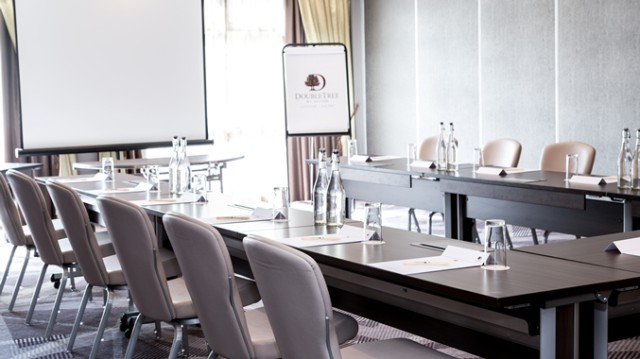 DoubleTree Hilton Ealing Venue Hire W5, smaller meeting room, large screen and flipchart, boardroom style meeting, natural daylight